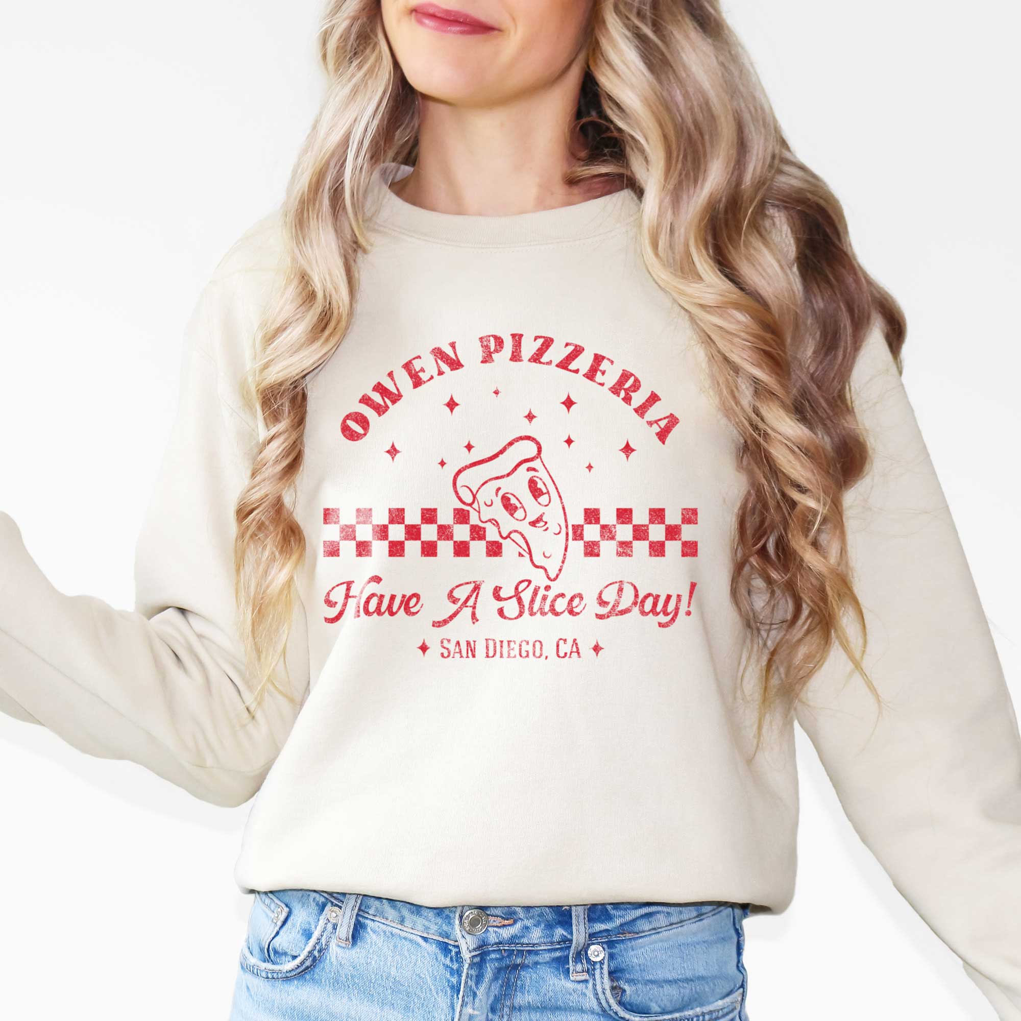 a man wearing a personalized Retro Pizza Sweatshirt in sand