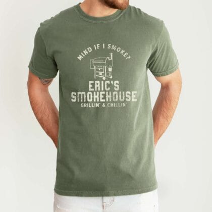 a man wearing a Personalized Smoker Grill T-Shirt in moss