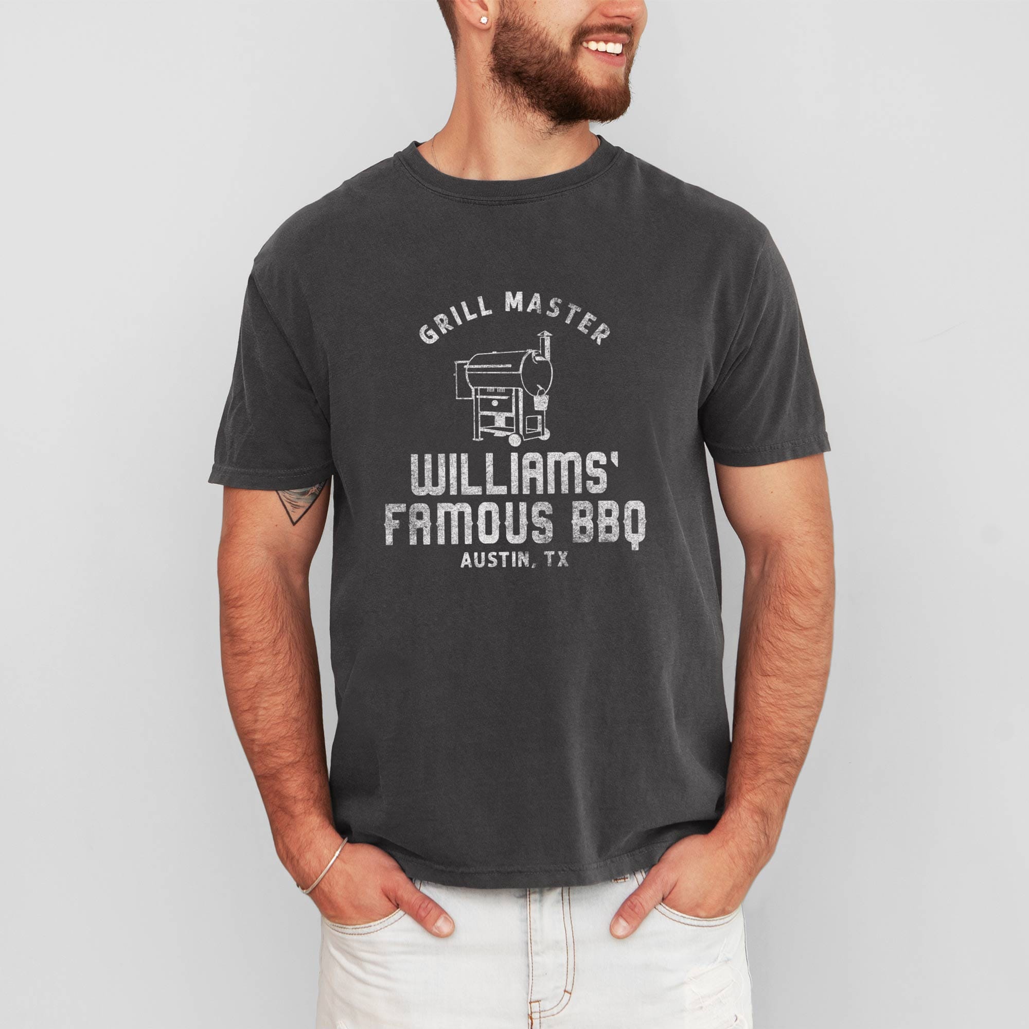 a man wearing a Personalized Smoker Grill T-Shirt in pepper