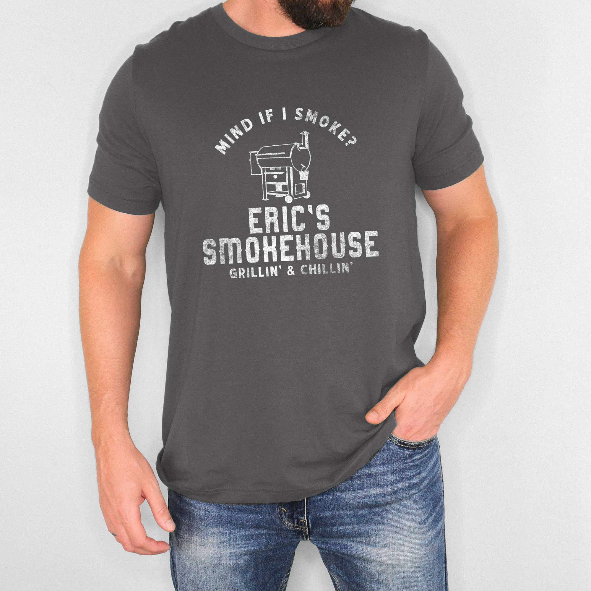 a man wearing a Personalized Smoker Grill Shirt in asphalt