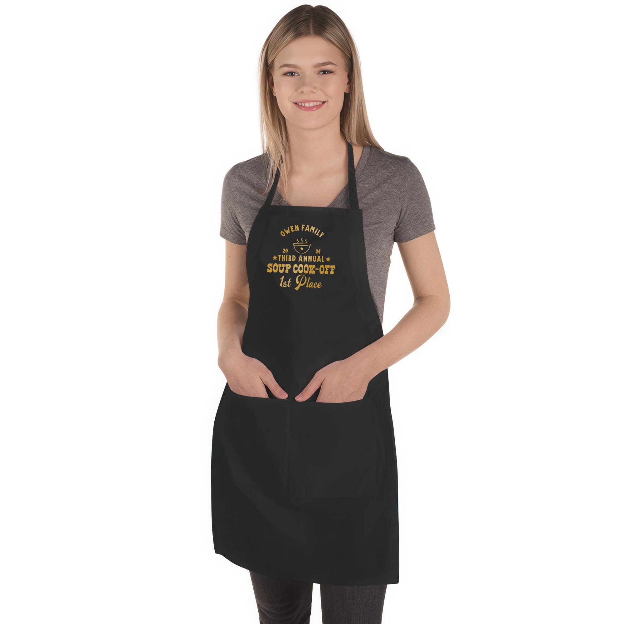 a woman wearing a custom butcher western chili cook off winner apron in black