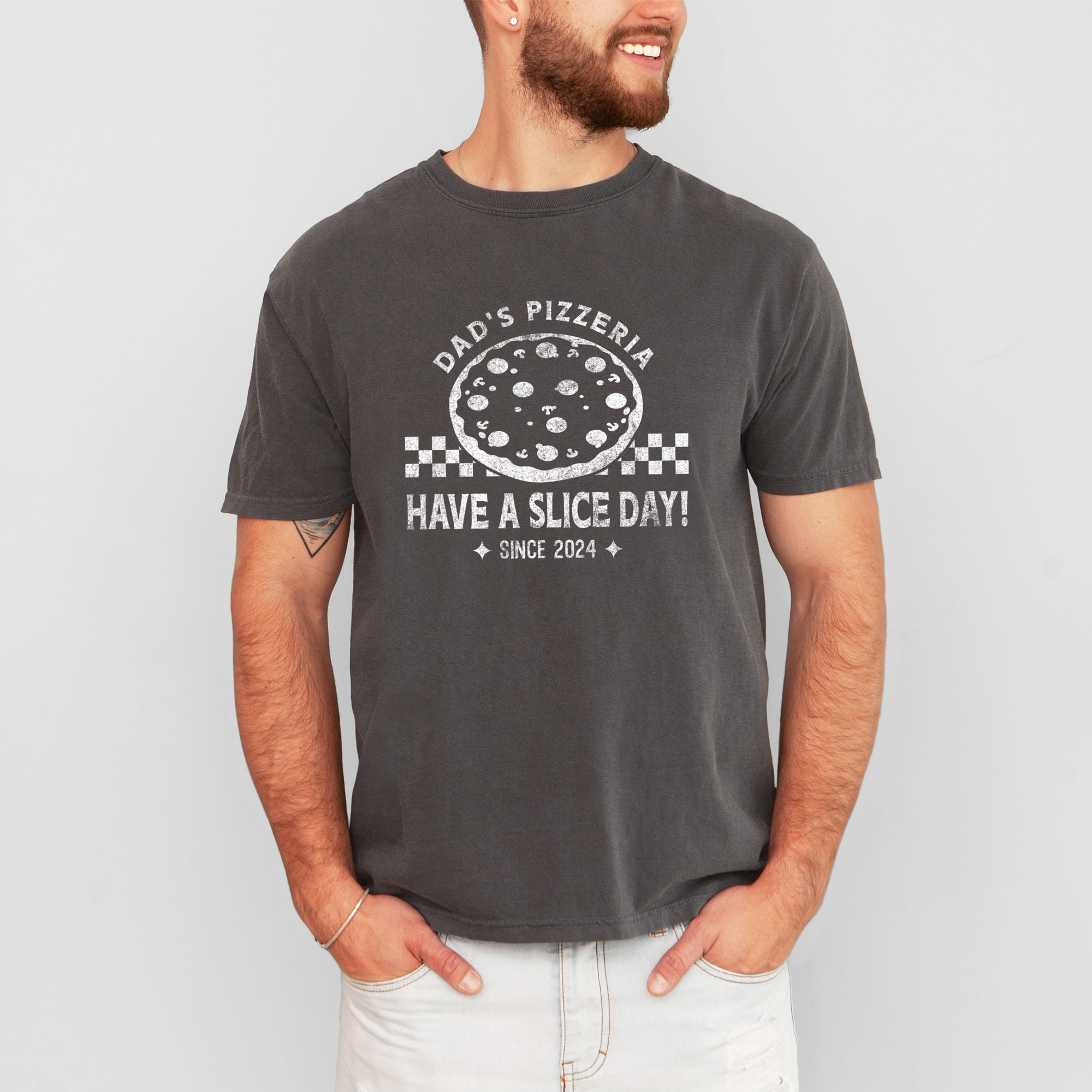 a man wearing a a checkered pizza t-shirt in pepper