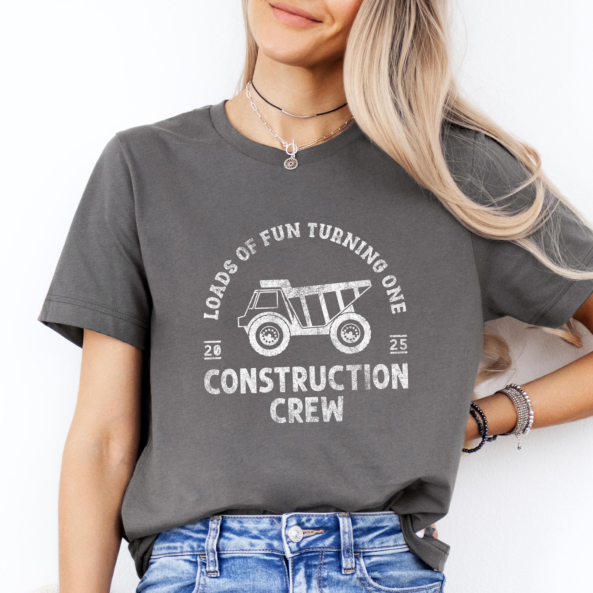a woman wearing a Construction Crew Shirt in asphalt
