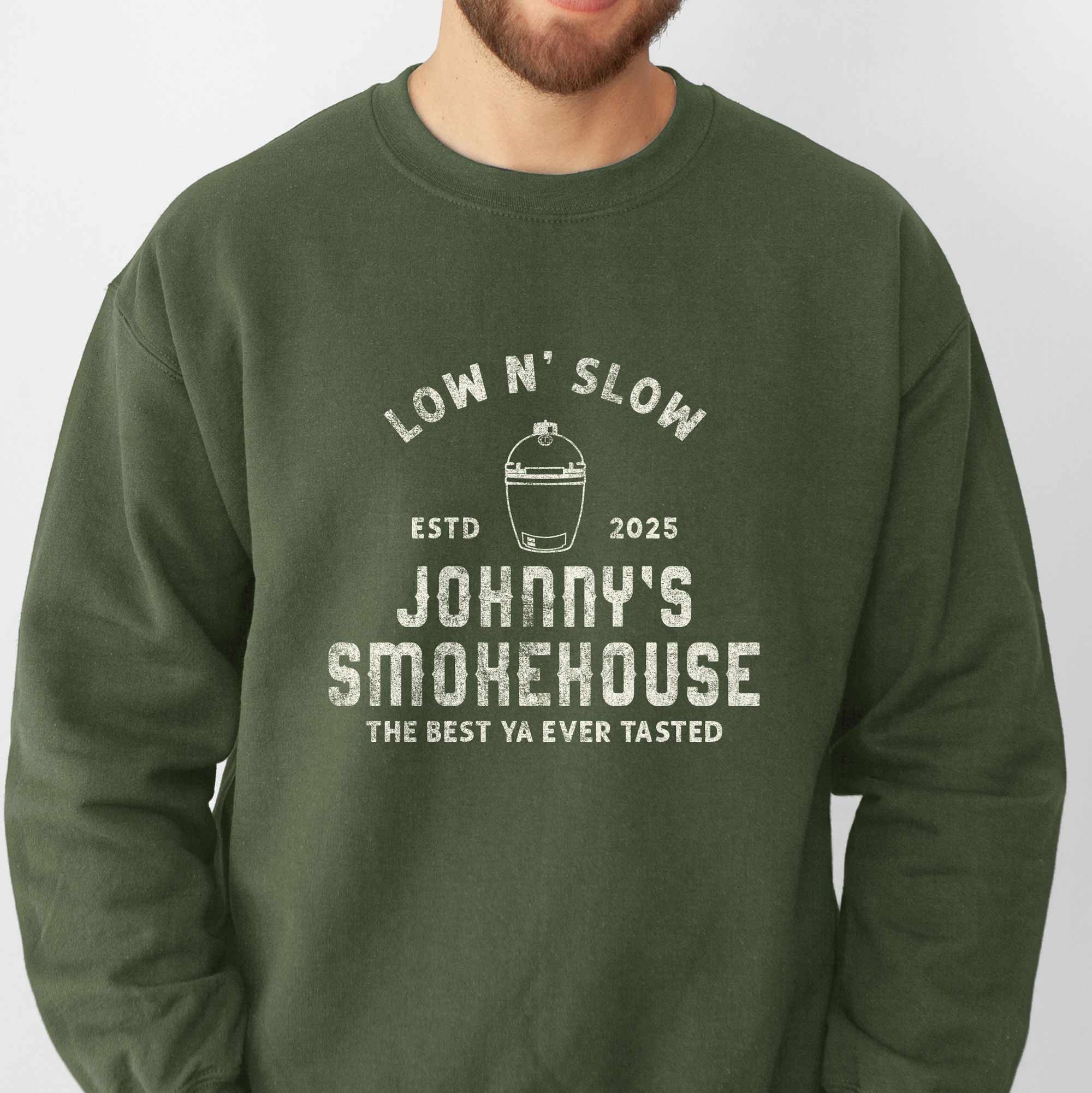 closeup of a man wearing a Personalized Meat Smoker Sweatshirt in military green