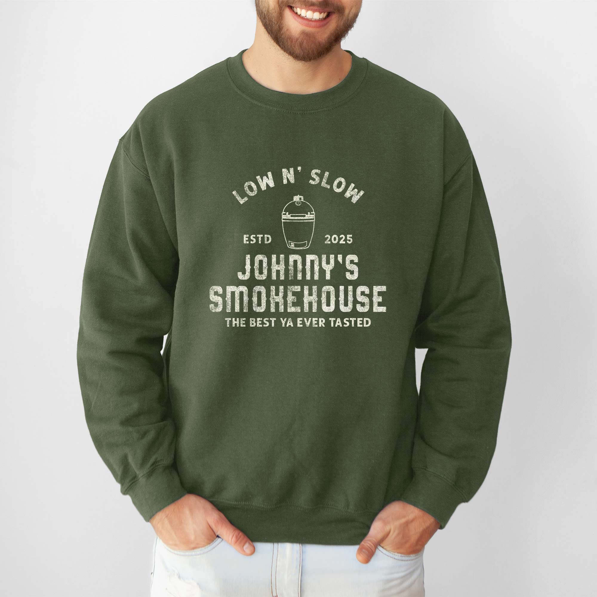 a man wearing a Personalized Meat Smoker Sweatshirt in military green