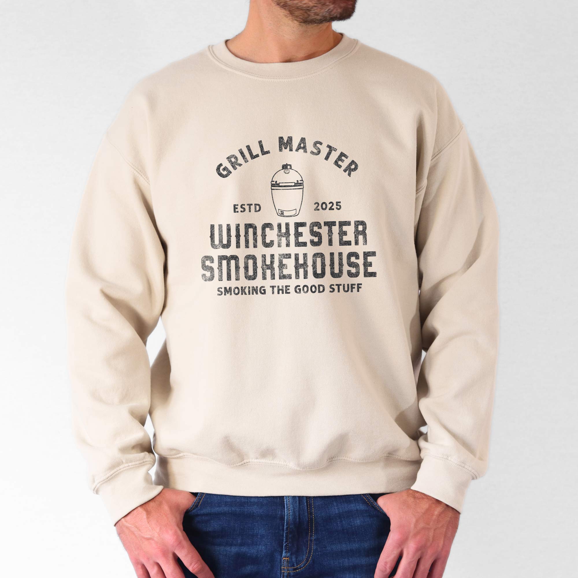 a man wearing a Personalized Meat Smoker Sweatshirt in sand
