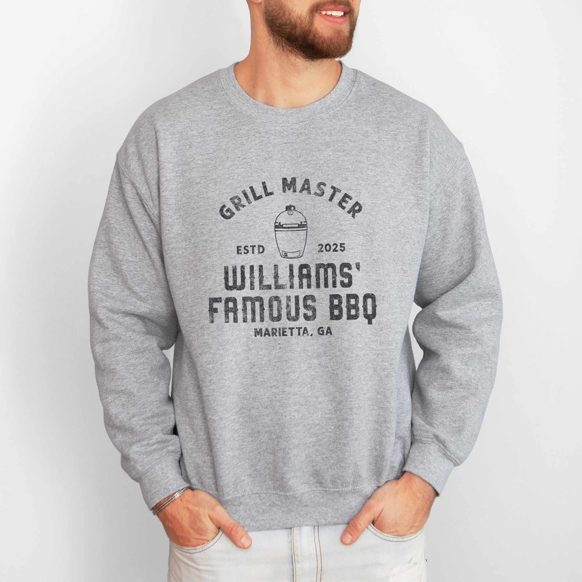 a man wearing a Personalized Meat Smoker Sweatshirt in sport grey