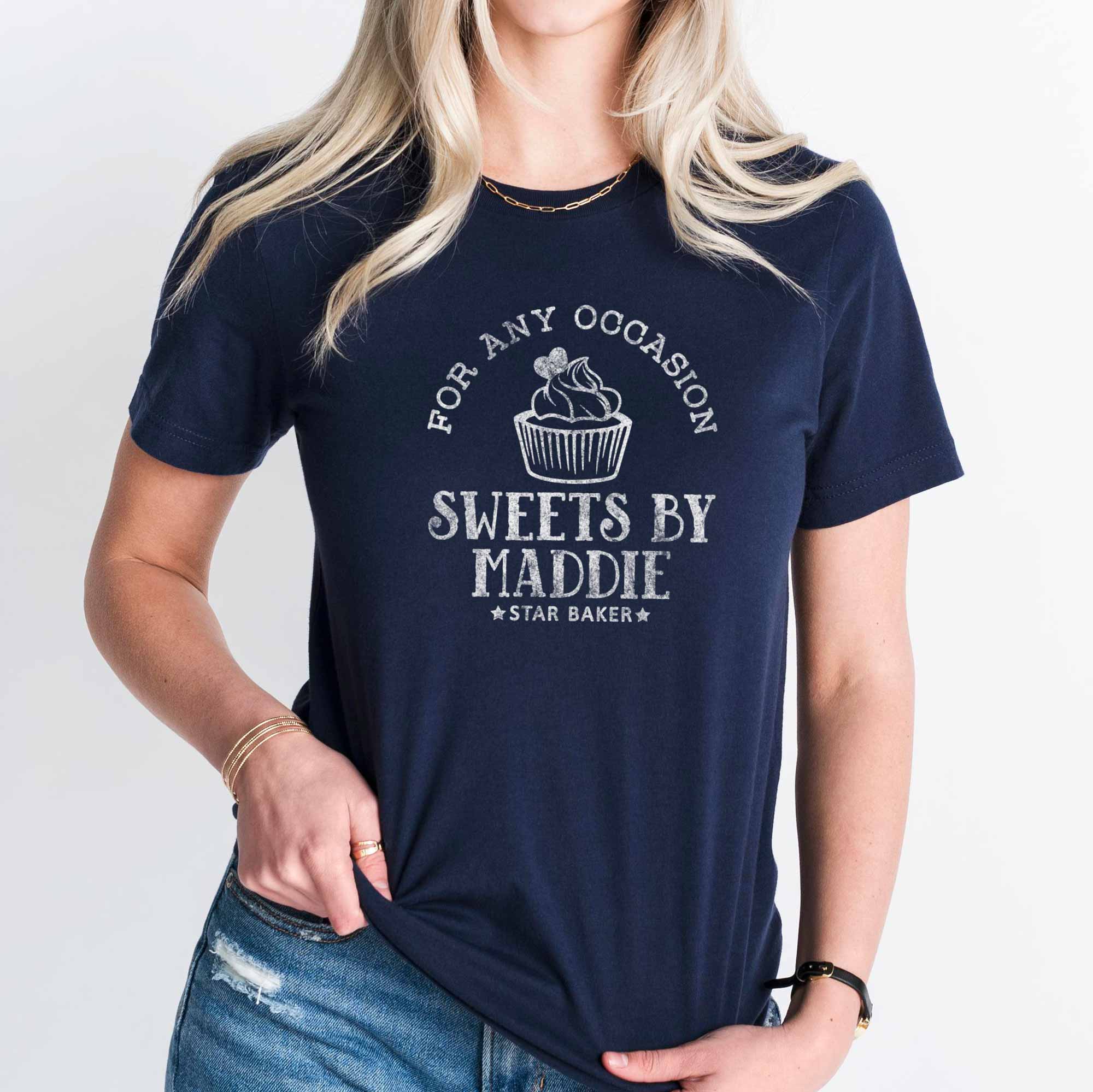 a young woman wearing a Cupcake Baking T-Shirt in navy
