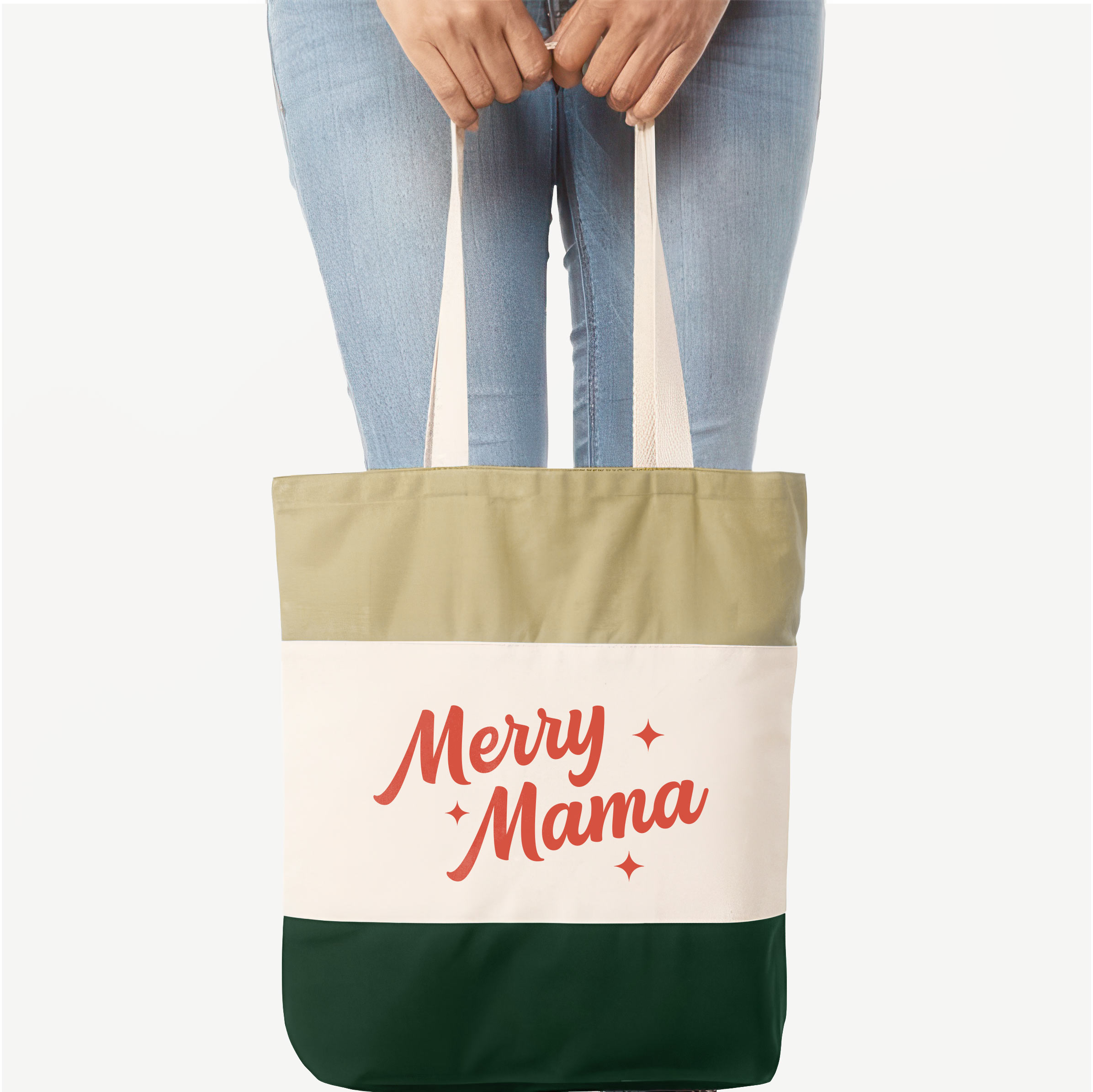 a woman holding a Retro Merry Mama Tote bag in forest green