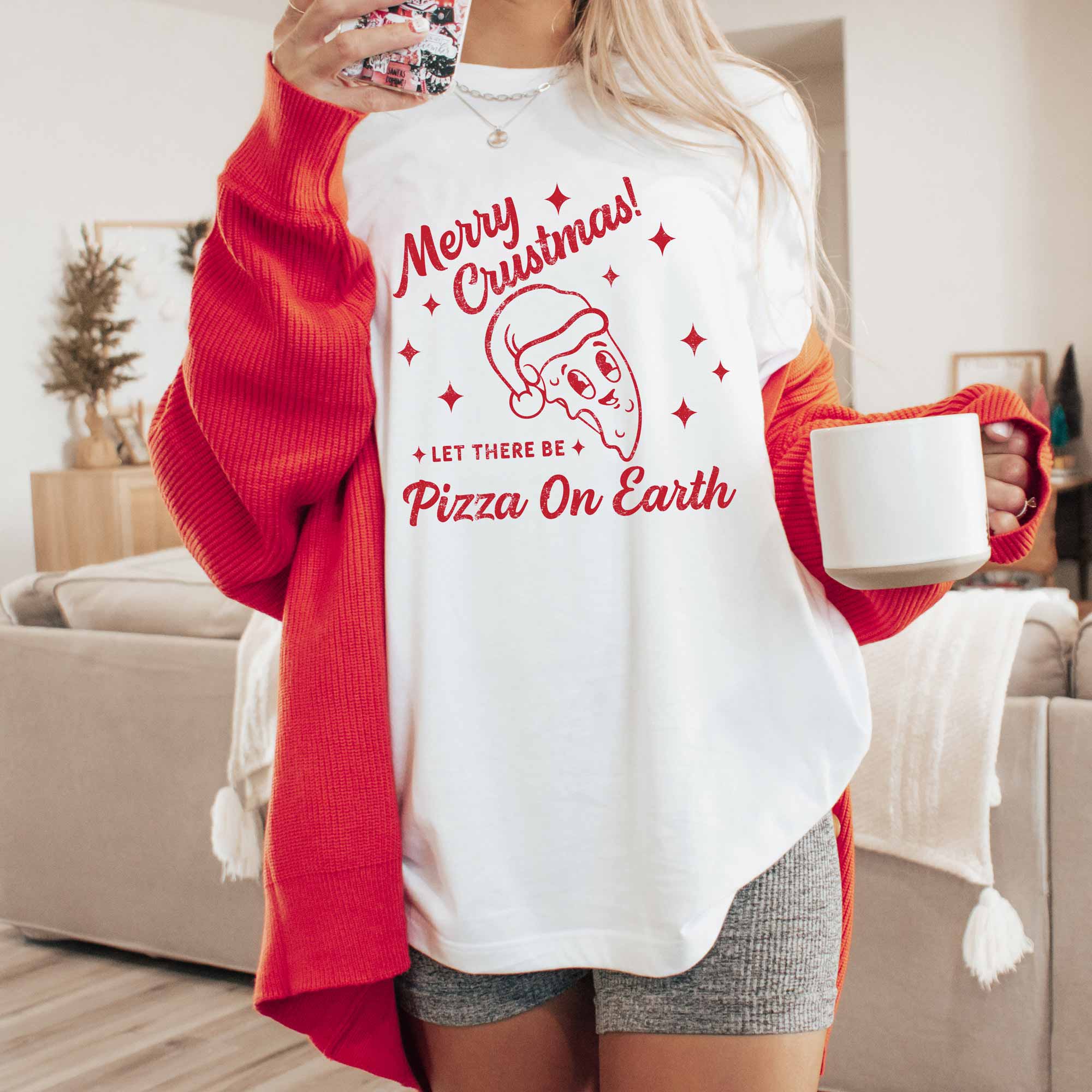 a woman wearing a retro pizza Christmas shirt in white