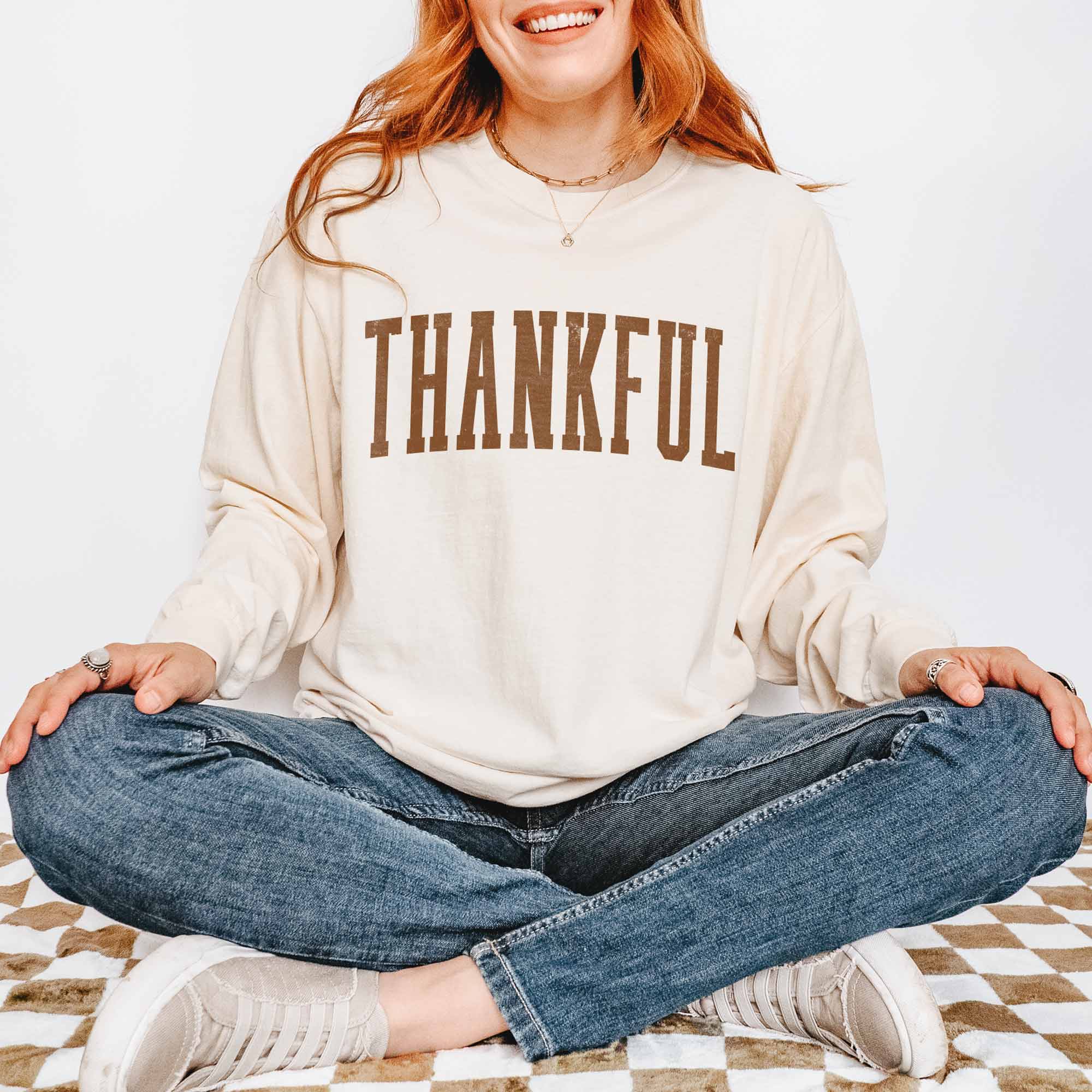 a woman wearing a Thankful Long Sleeve Tee