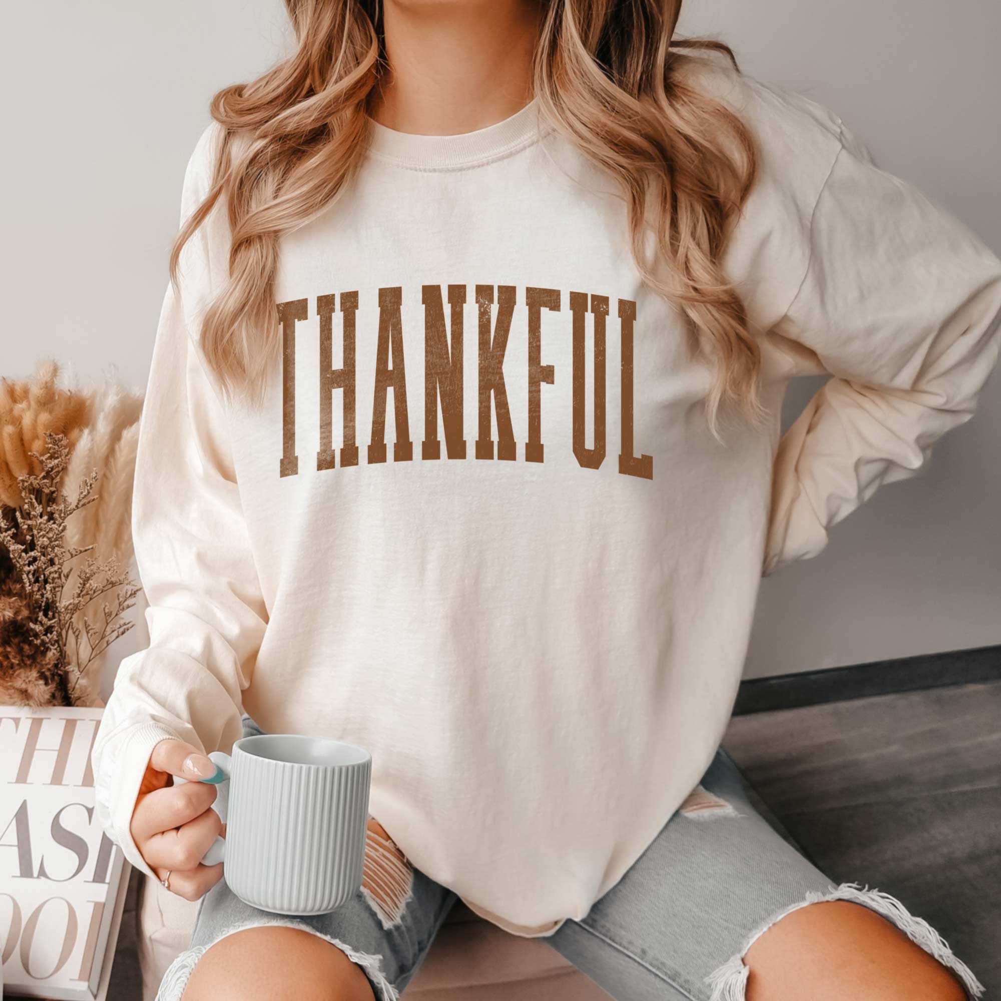 a woman wearing a Thankful Long Sleeve Tee