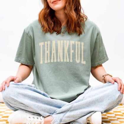 a young woman wearing a Thankful T-Shirt in bay