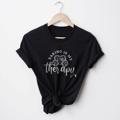 a Baking Is My Therapy Shirt, with a cookie graphic, in black