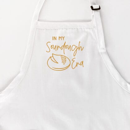 an In My Sourdough Era Apron in white