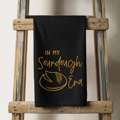 a sourdough era tea towel in black