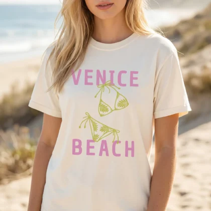 a woman on the shore wearing a Venice Beach Shirt in ivory