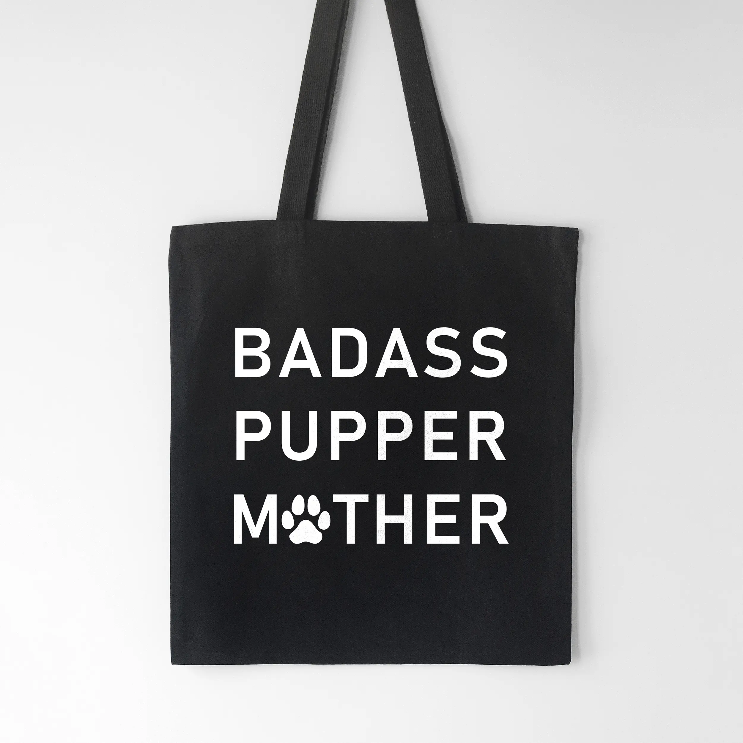 a badass pupper mother tote bag in black