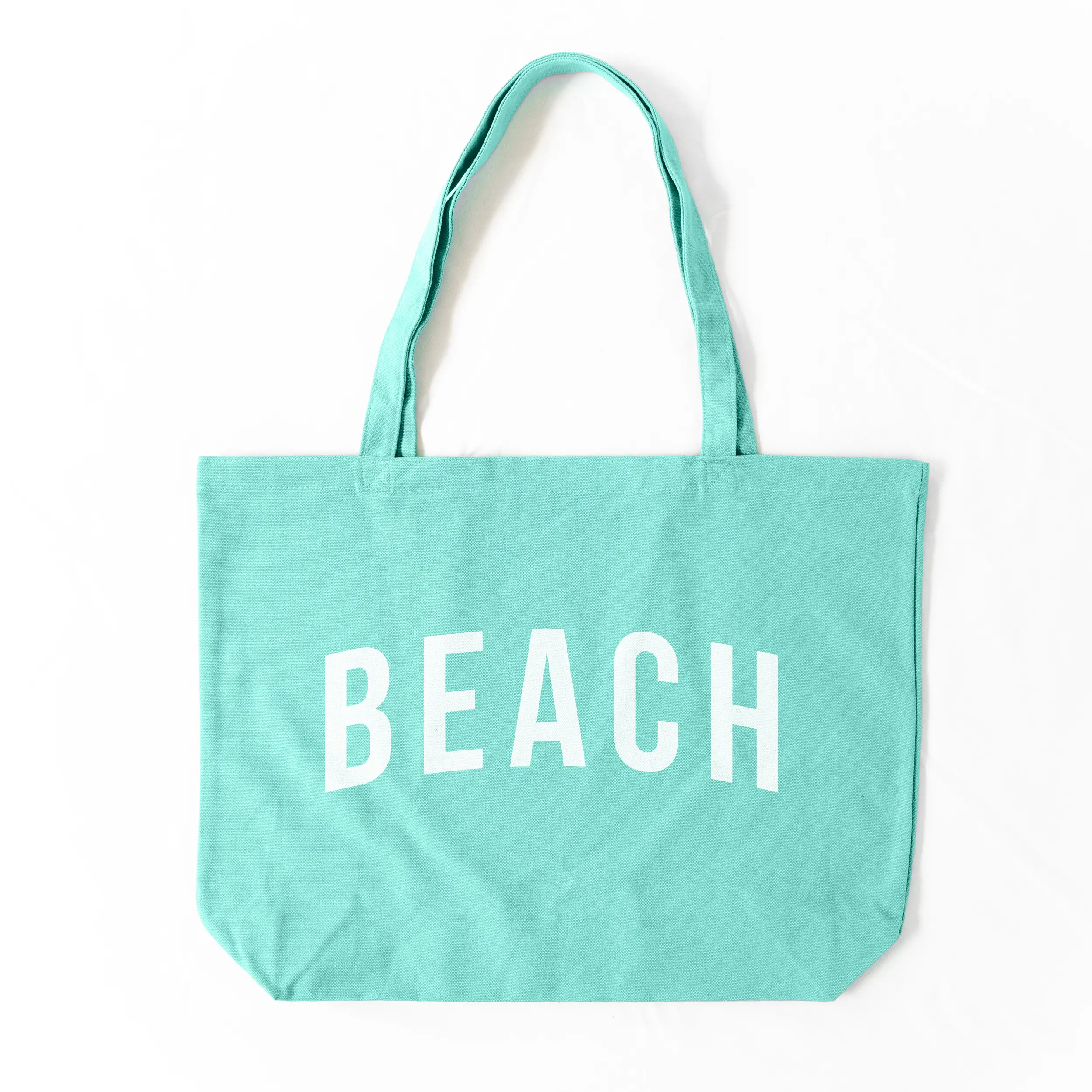 a Pigment beach tote in sea glass