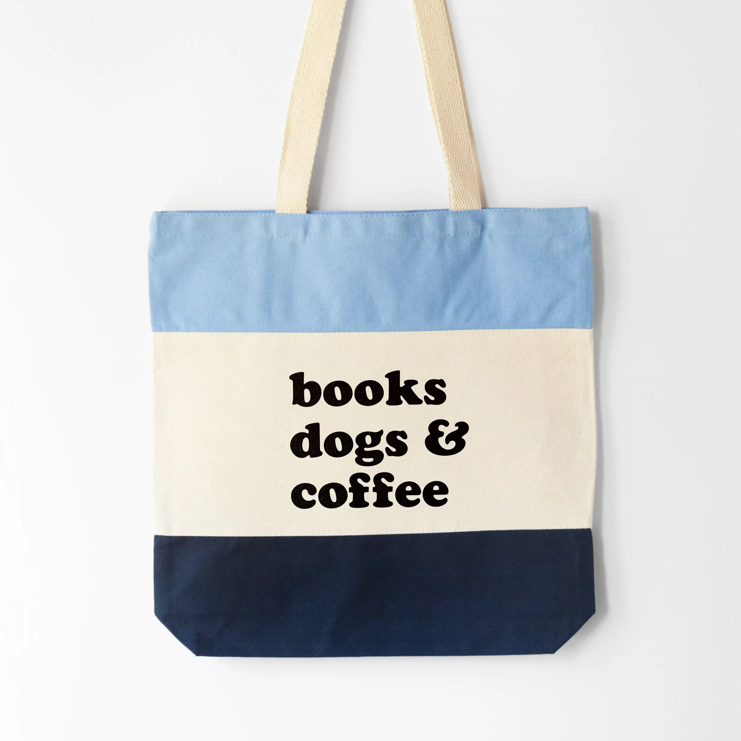 A books dogs and coffee tote in blue