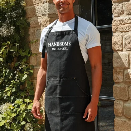 a man wearing a Handsome Grill Apron in black denim