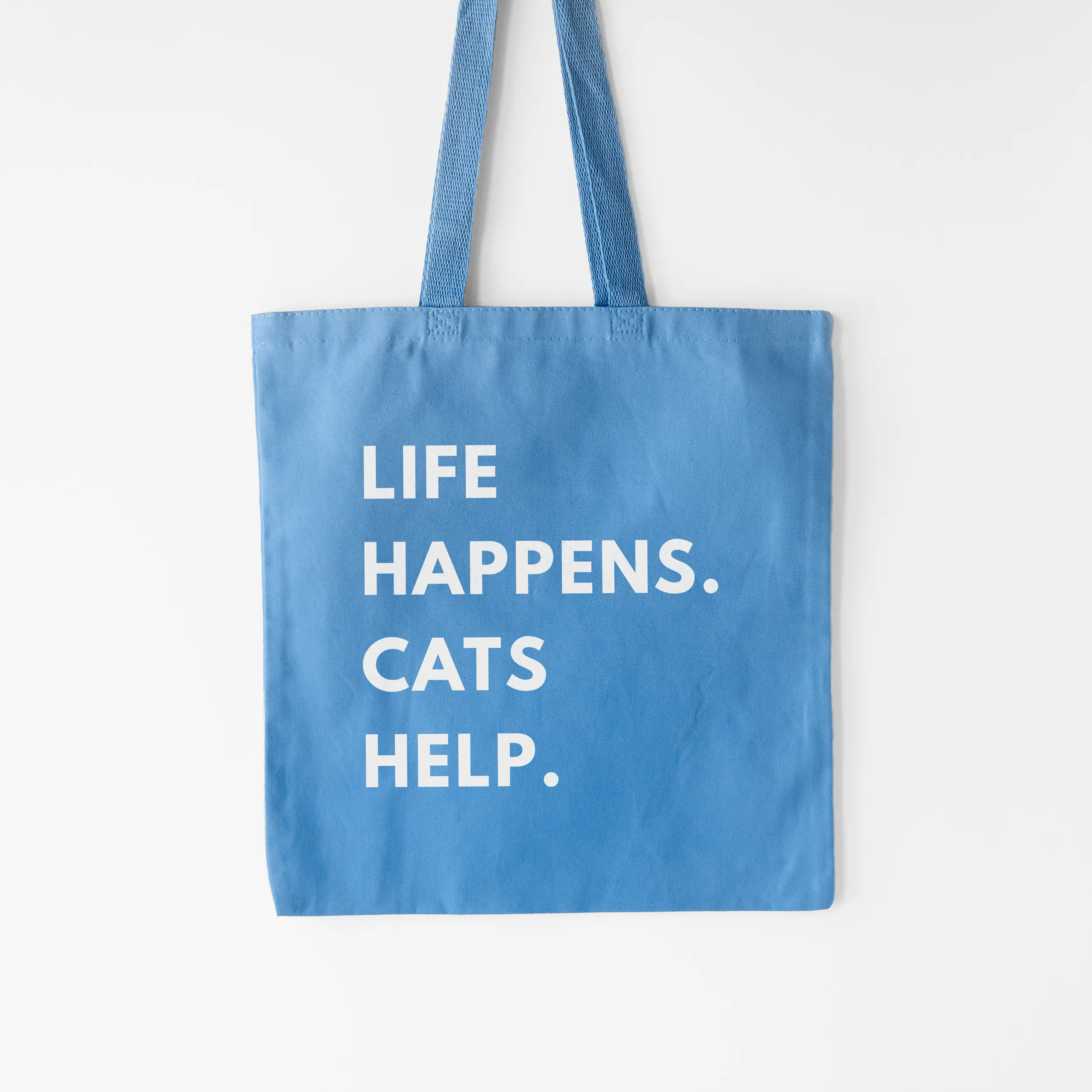 a life happens cats help tote in carolina blue
