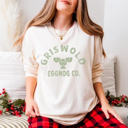 A young woman wearing a Griswold Eggnog Shirt in Ivory