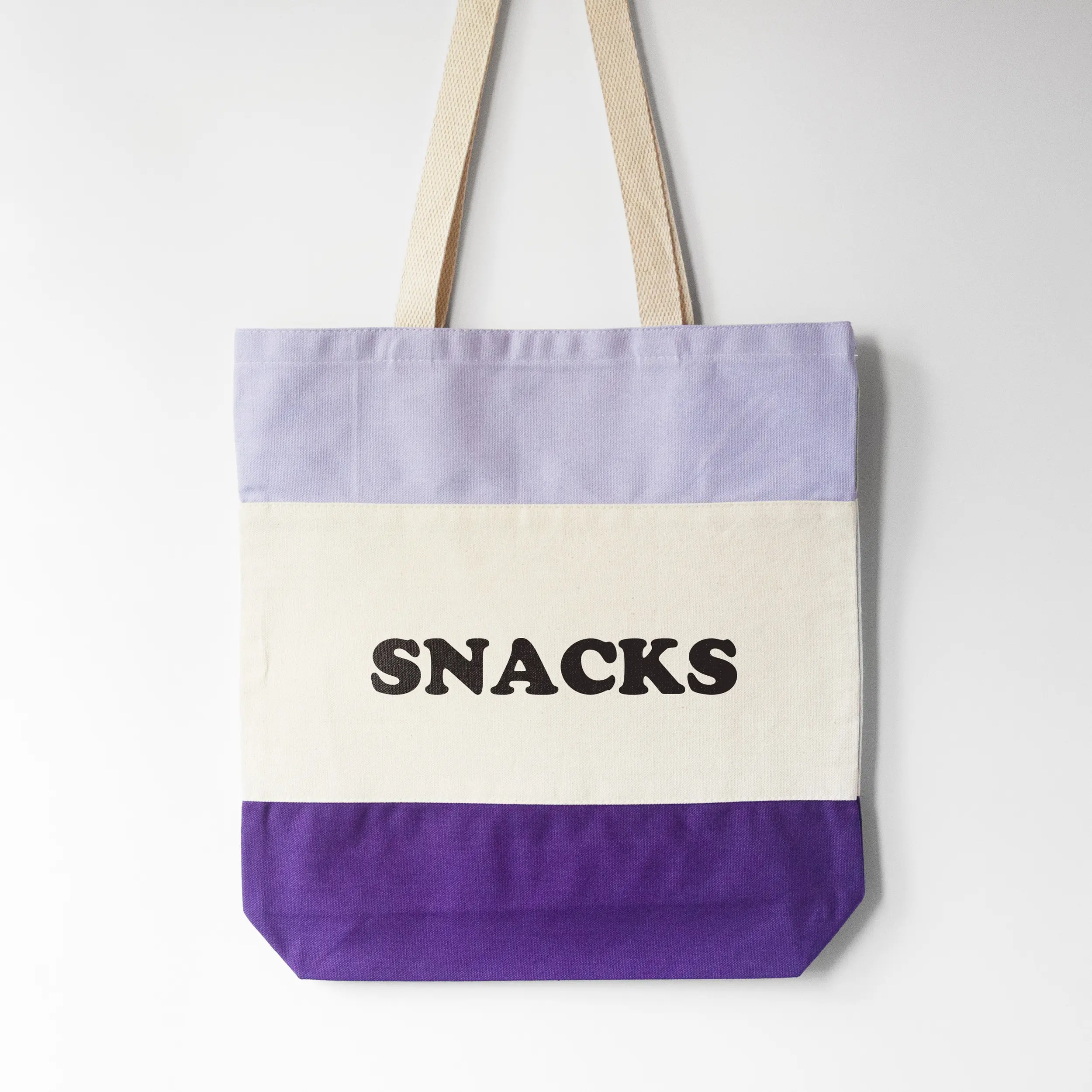 a snacks tote bag in purple