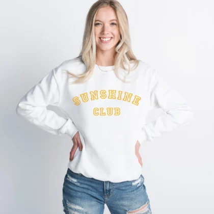 a woman wearing a Sunshine Club Sweatshirt in white