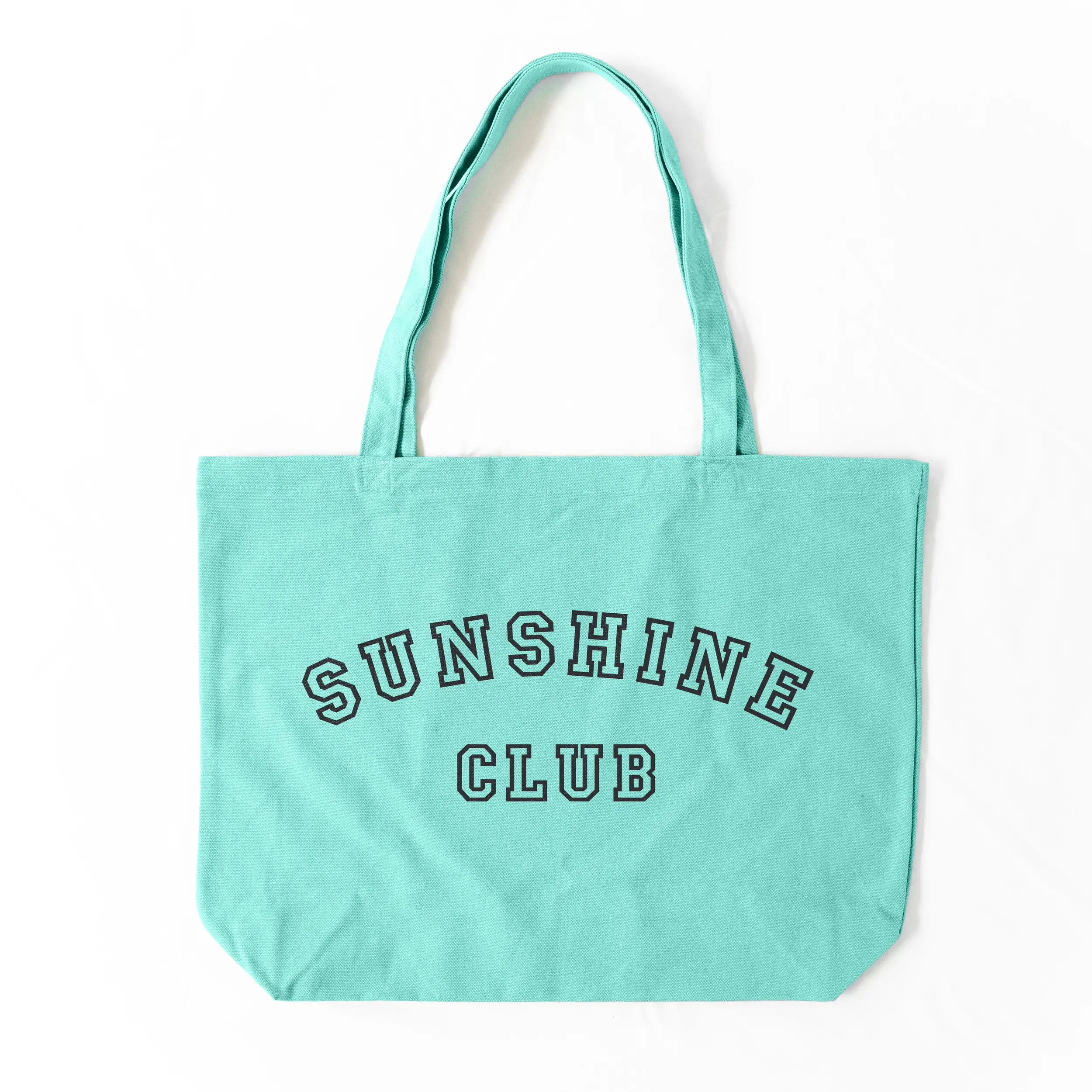 a Sunshine Club Pigment Tote in sea glass