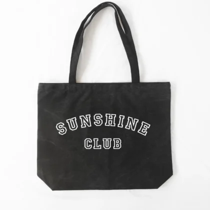 a Sunshine Club Pigment Tote in washed black