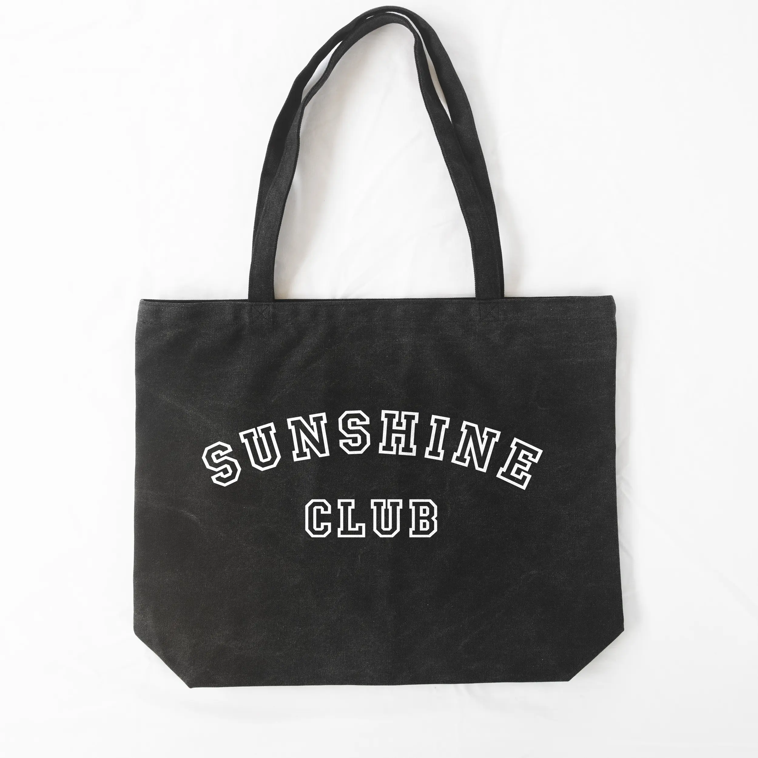 a Sunshine Club Pigment Tote in washed black
