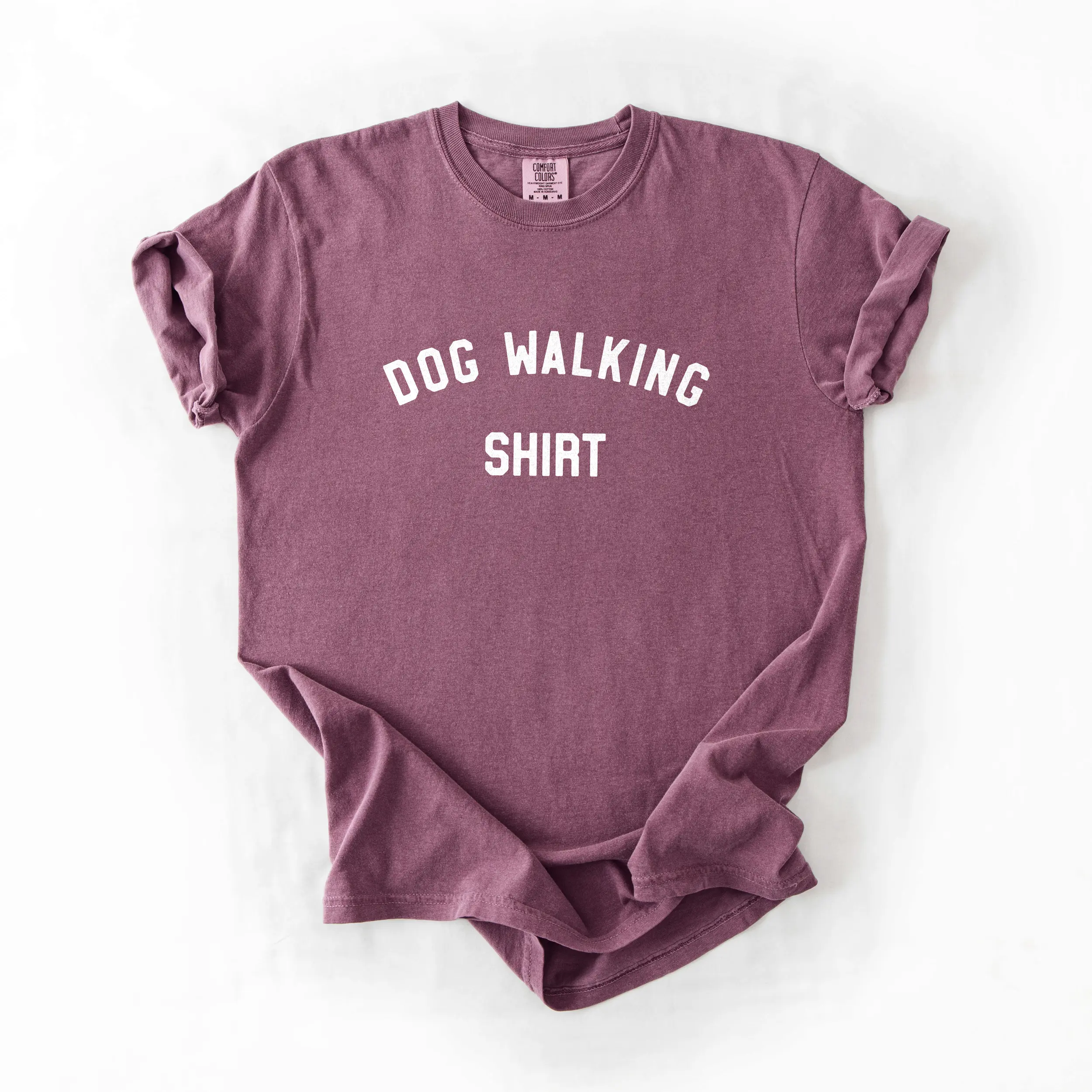 a dog walking shirt in berry