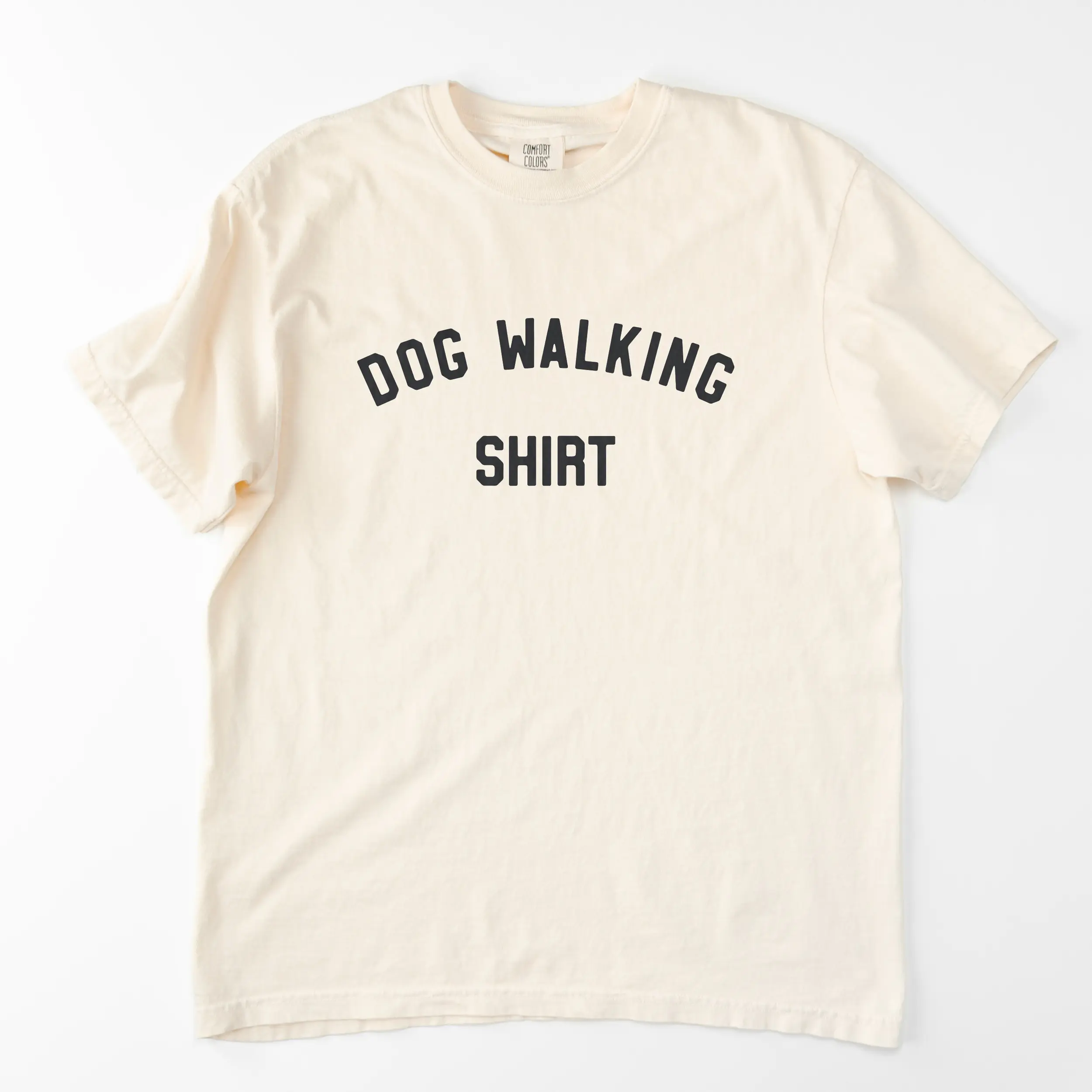 a dog walking shirt in ivory