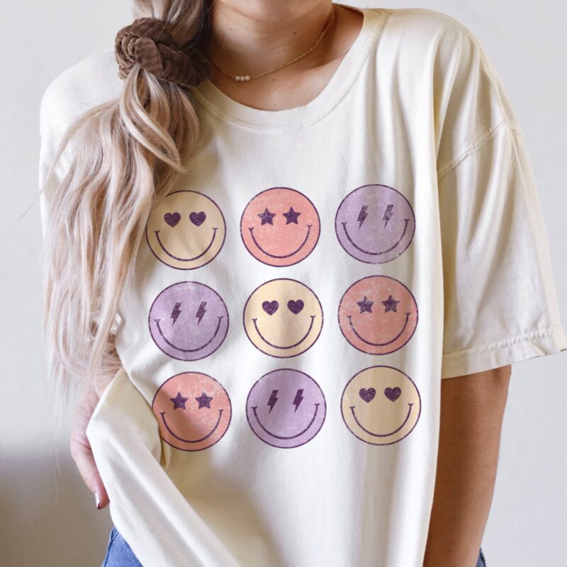 a young woman wearing a Love Moods Comfort Colors Tee in Ivory